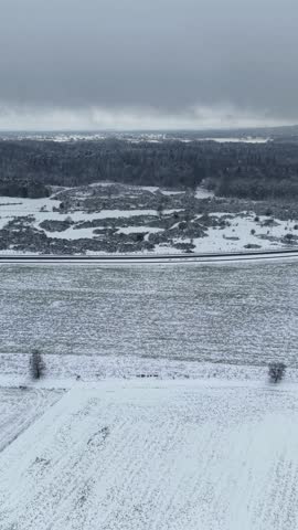 Aerial view of snowy forest landscape in winter