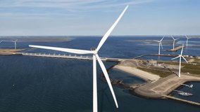Wind turbine blades spinning for renewable energy generation - Powered by Shutterstock - Get 15% off with code: PIKWIZARD15