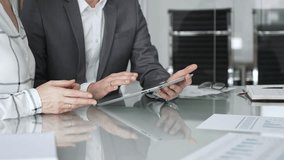 Business people hands discussing data on digital tablet during an office meeting, planning strategy and analyzing results - Powered by Shutterstock - Get 15% off with code: PIKWIZARD15