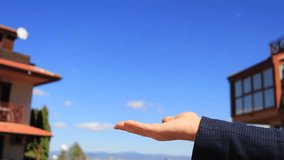 A real estate agent hands over the keys to a new apartment to a tenant. A successful apartment purchase or rental. A silver house-shaped keychain. Selling and buying a house. - Powered by Shutterstock - Get 15% off with code: PIKWIZARD15