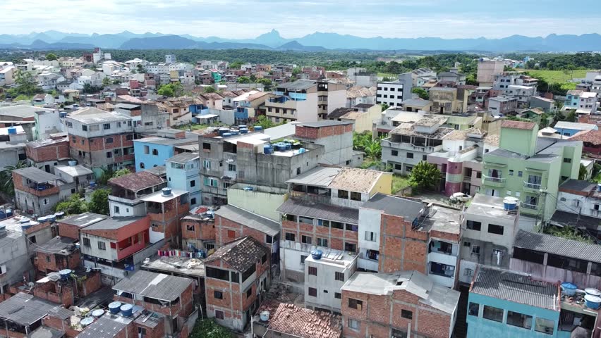 Far-reaching aerial view of a sprawling hillside urban area.