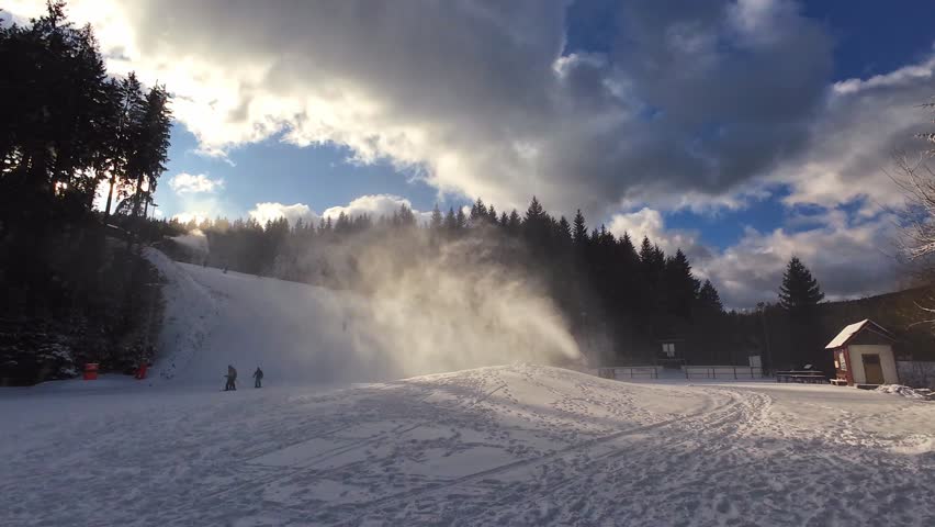 Snow Cannon Blowing Artificial Snow maintains Winter Ski piste safety