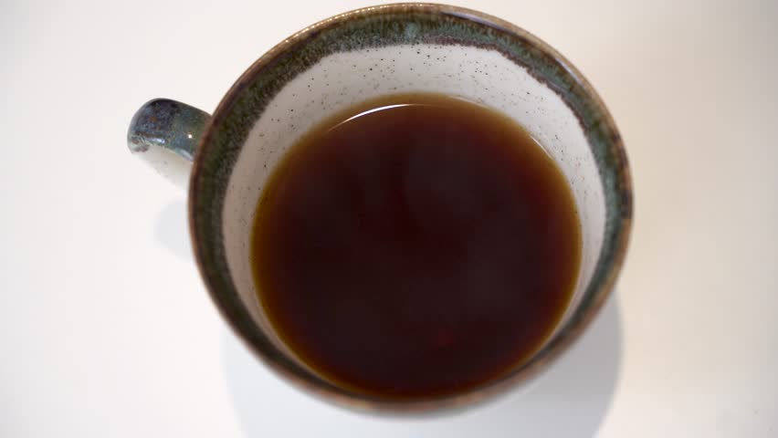 Close up of putting milk in filter coffee