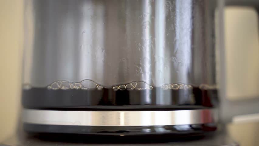 Close up of brewed filter coffee in electric glass coffee pot