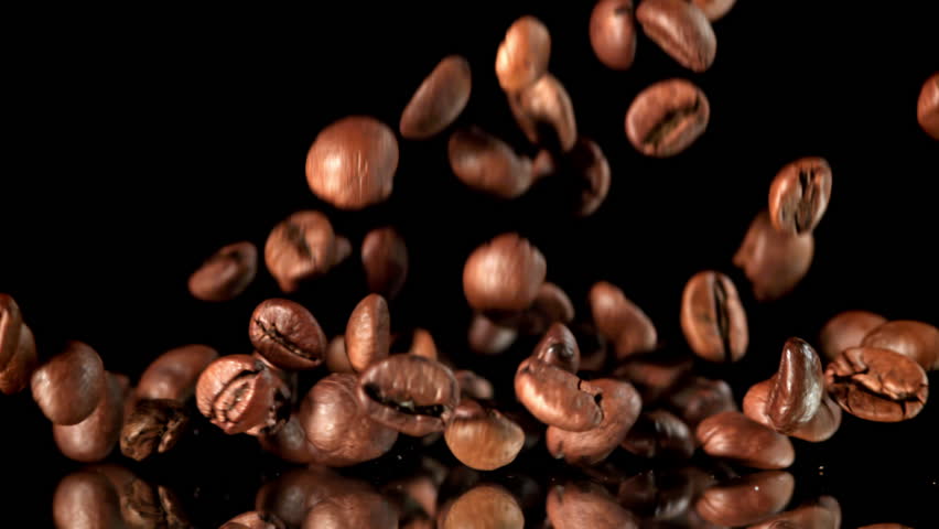 Super slow motion roasted coffee beans . Filmed on a high-speed camera at 1000 fps. High quality FullHD footage