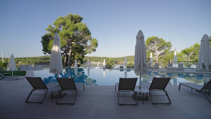 Luxury pool and sunbeds in Croatia, motion forward view