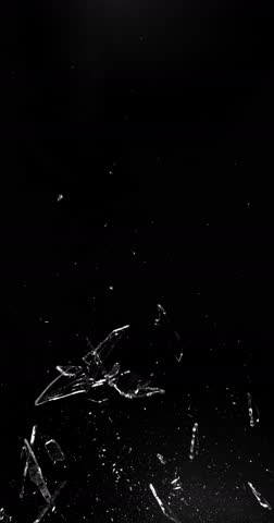 Super slow motion shattering glass filmed at 1000fps, side view with flying shards and dust isolated on black background. Perfect VFX overlay element for impact, crash or transition.