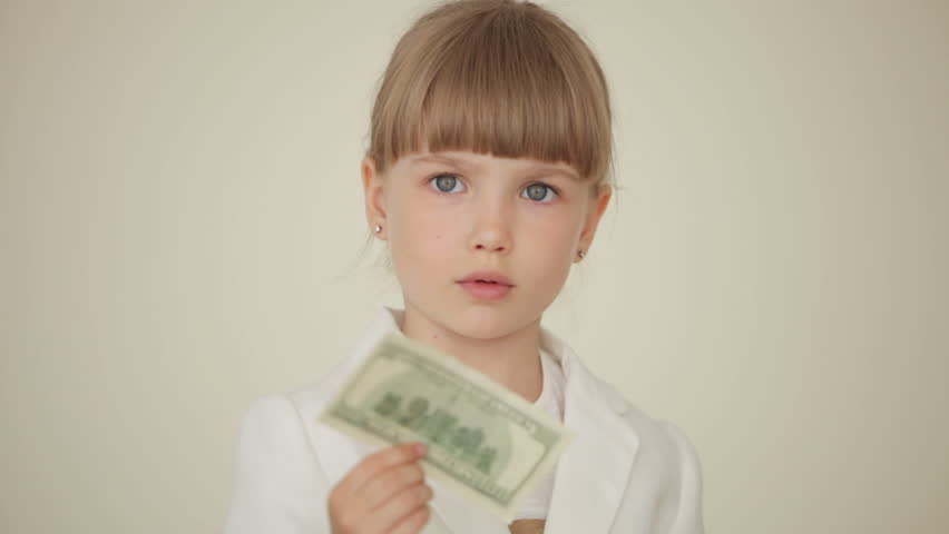 Little girl holding a money bill
