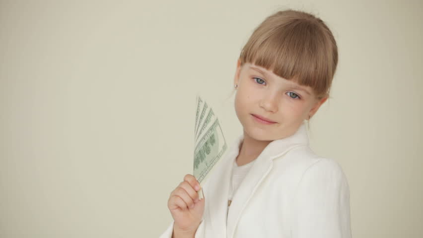 Little businesswoman with dollars
