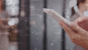 Animation of molecules over hands of caucasian man using smartphone. Network, connections, communication and working with technology concept digitally generated video. - Powered by Shutterstock - Get 15% off with code: PIKWIZARD15