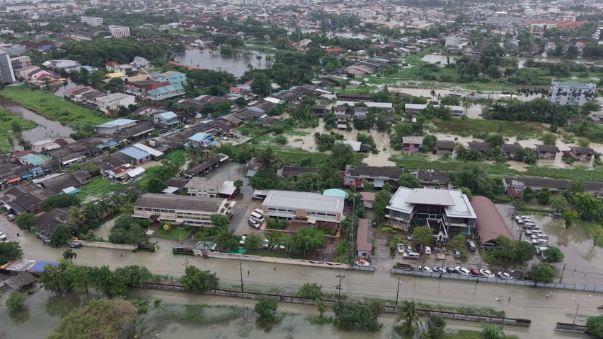 High-angle drone footage showing flooded streets, houses, and office buildings in Mueang Songkhla, Thailand, during the 26 November 2025 floods.