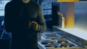 Man using tablet in kitchen with data processing animation over him. Technology, gadget, digital, modern, innovation - Powered by Shutterstock - Get 15% off with code: PIKWIZARD15