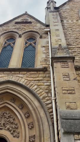 Wesley Memorial Church in central Oxford with its tall spire and Gothic Revival architecture. Concept of Victorian religious heritage, city landmarks, and historic Oxford churches