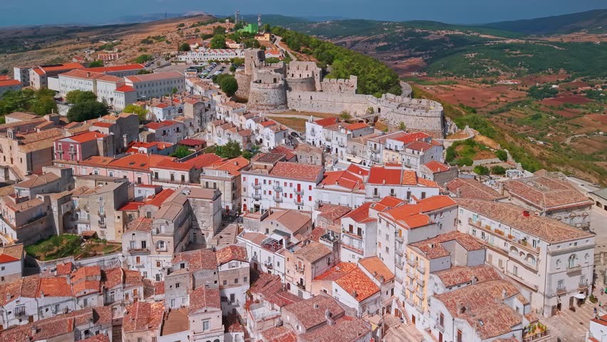 Aerial view of Monte Sant Angelo town on the Gargano peninsula in Italy. Famous for Sanctuary of San Michele Arcangelo and a medieval hilltop fortress overlooking the Adriatic Sea