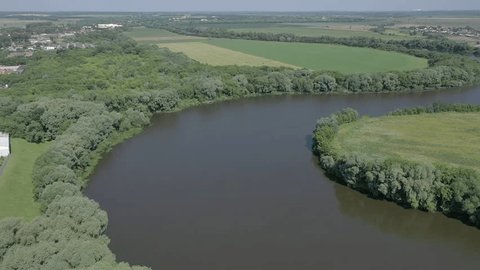 Aerial Flight Descending over River Landscape