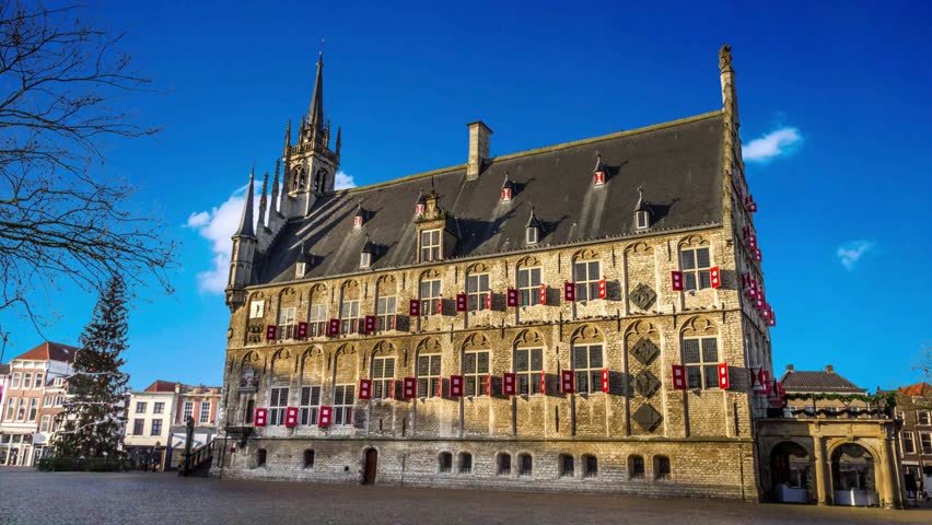 Gouda, Netherlands Medieval Historical Town Hall on Market SquareThe historic town hall of Gouda NetherlandsThe historic town hall of Gouda Netherlandsthe netherlands, destination,  ornamental, sight, antique, ornate, center, stadhuis van  city council,   facade, attraction, medieval, tradition, street, sightseeing, historical, market, old, architecture, tourist, city, tower, europe, travel, history, tourism, courtyard, square, ancient, netherlands, holland, historic, gothic, stonework,  city  residence, landmark, cityscape, building, house, monument, town hall meeting, market - retail space,  - south holland, outdoors