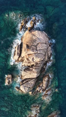 Rocky Island Surrounded By Ocean