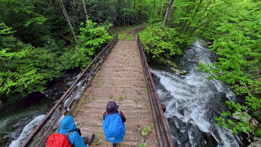 High Angle of Couple Crossing Bridge to Wide Trail in Great Smoky Mountains