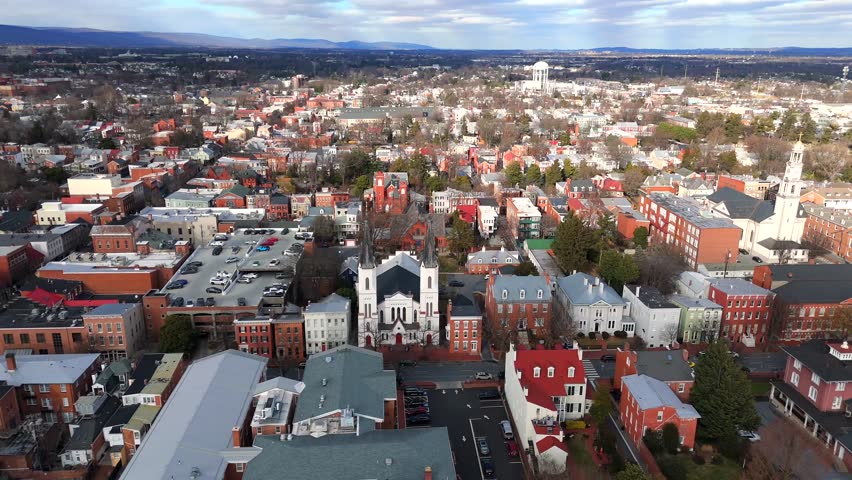 Aerial shot of small town center with historic churches in Frederick Maryland