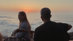 Couple Watching Atlantic Sunset While Playing Guitar.

Young couple enjoying a peaceful sunset by the Atlantic Ocean, with a man playing guitar as they connect, relax, and watch the sun set over the sea. - Powered by Shutterstock - Get 15% off with code: PIKWIZARD15