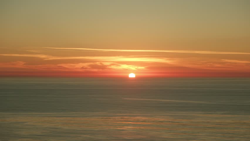 Beautiful peaceful orange pink sunset over ocean in San diego California