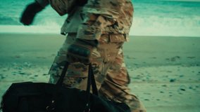 American Soldier Service Man Walks on Beach Near Ocean with Bag in Hand - Powered by Shutterstock - Get 15% off with code: PIKWIZARD15