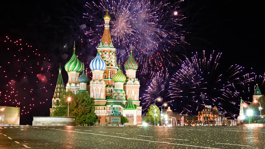 Temple of Basil the Blessed and fireworks in honor of Victory Day celebration (WWII), Red Square, Moscow, Russia. Time lapse 
