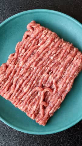 Raw ground beef or pork, fresh meat for burgers or other dishes. Raw ground beef as a food background