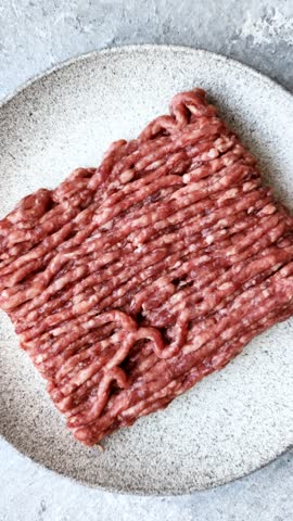 Raw ground beef or pork, fresh meat for burgers or other dishes. Raw ground beef as a food background