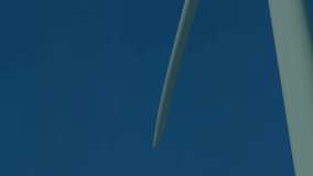 Animation of wind turbine, male engineer and financial data processing. Global wind energy, connections, computing and data processing concept digitally generated video. - Powered by Shutterstock - Get 15% off with code: PIKWIZARD15