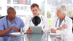 Animation of network of connections with icons over diverse doctors. Global medicine, connections, computing and data processing concept digitally generated video. - Powered by Shutterstock - Get 15% off with code: PIKWIZARD15