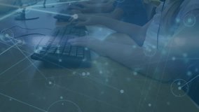 Animation of connections and binary code over happy caucasian boy with computer at school. School, education and learning with technology concept digitally generated video. - Powered by Shutterstock - Get 15% off with code: PIKWIZARD15