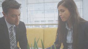 Animation of network of connections with icons over business people in office. Global business, finance, connections, networks and data processing concept digitally generated video. - Powered by Shutterstock - Get 15% off with code: PIKWIZARD15