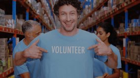 Animation of network of profile icons over caucasian male volunteer showing thumbs up at warehouse. Charity and donation concept - Powered by Shutterstock - Get 15% off with code: PIKWIZARD15