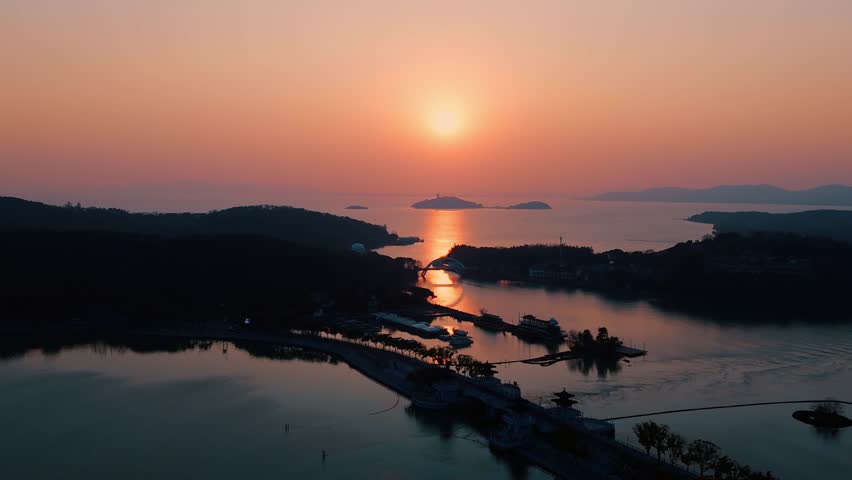 Golden Serenity: A Breathtaking Aerial Sunset Over the Sacred Islands of Taihu Lake, Wuxi.