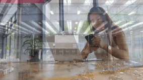 Animation of woman using laptop over warehouse. global business, connections and digital interface concept digitally generated video. - Powered by Shutterstock - Get 15% off with code: PIKWIZARD15