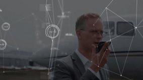 Animation of data processing over caucasian businessman talking on smartphone. Global business and digital interface concept digitally generated video. - Powered by Shutterstock - Get 15% off with code: PIKWIZARD15