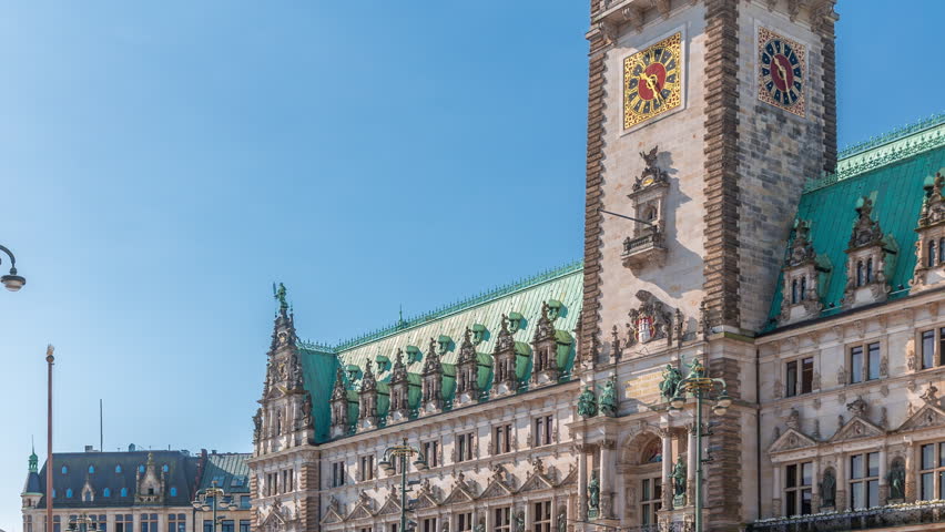 Building of the Hamburg City Hall timelapse, the seat of the government of Hamburg, located in the Altstadt quarter in the city center. Front view from the main square under a blue clear sky