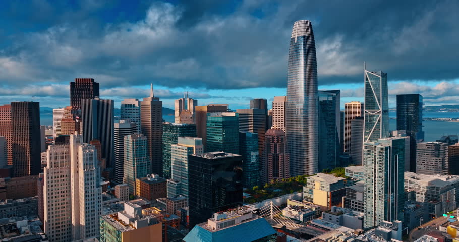 High-rise skyline of San Francisco, CA, USA from drone. Dramatic cloudscape covers the sky at backdrop.