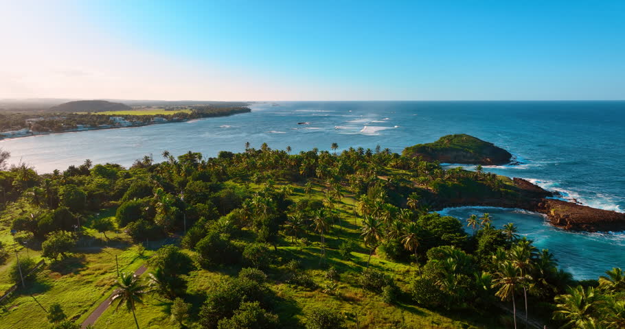 Amazing picturesque landscape of nature with lush greenery. Vast waterscape with rolling waves at backdrop. Aerial view. Puerto Rico.