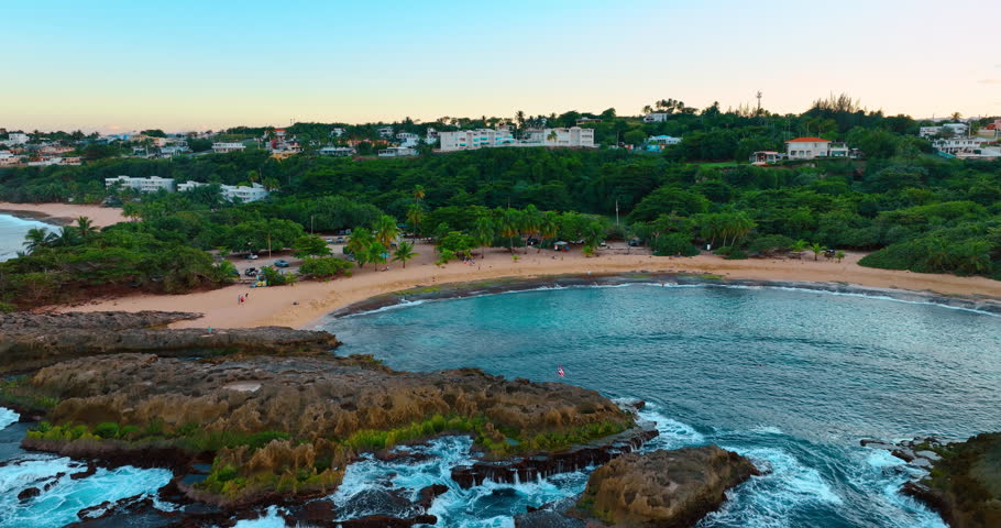 Spectacular Mar Chiquita Beach in Manati, Puerto Rico. Distancing form gorgeous coast revealing view on the green cityscape.