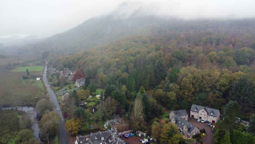 Drone shot of the beautiful small town of Aberfoyle Scotland 