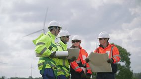 Engineers working on site in wind turbine farm, Wind turbines generate clean energy source, Eco technology for electric, industry environment, sustainable technology wind power maintenance. - Powered by Shutterstock - Get 15% off with code: PIKWIZARD15