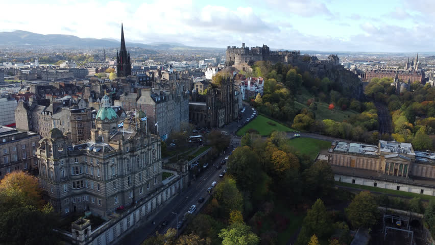 Drone shot with both Edinburgh Castle and the Scott Monument 