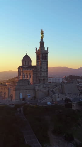 Vertical Aerial City Sunrise Scene, Morning Glow Over Marseille Port, Sunrise Bathes Lively Marseille Harbor In Light. France