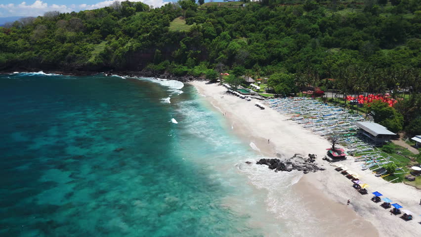 Above view of tropical beach with ocean waves, paradise coastline