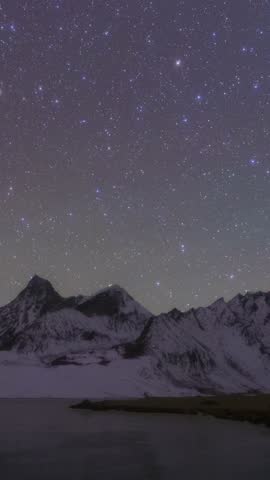 4K Vertical Time-lapse of Milky Way and Starry Sky Over Snow-capped Mountains in Tibet