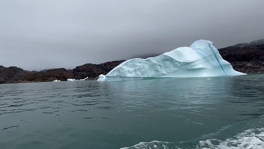 Experience the breathtaking beauty of Greenland’s Arctic landscape, where massive glaciers and towering icebergs float gracefully in pristine, turquoise waters. This serene yet dramatic scene highlights the raw power and untouched majesty of the polar regions, perfect for themes of nature, climate, adventure, and Arctic exploration.