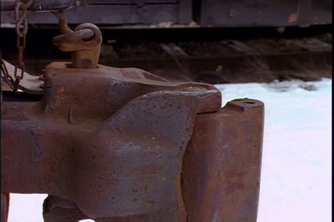Historical reenactment on Mid Continent Railway, New Freedom, Wisconsin.
Close up of 1885 steam train coupler from overhead. Another coupler moves into shot and hitches itself to the other. 