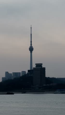 4K Vertical Time-lapse of Wuhan Guishan TV Tower with Rolling Clouds and Panoramic Cityscape